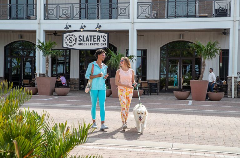 Founder’s Square | Babcock Ranch women walking from slaters in babcock ranch