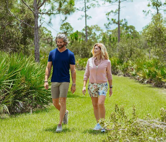 Community Trails | Babcock Ranch couple hiking in nature at babcock ranch | Babcock Ranch